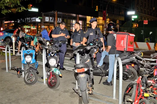NYPD Confiscated up to 80 Unlicensed Mopeds Outside Hotel Shelters
